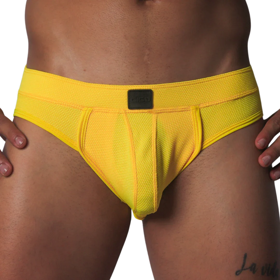 Bright yellow athletic mesh jockstrap with a wide waistband and a center black Gigo logo patch.