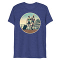 Blue heathered t-shirt featuring a circular graphic of two muscular men with luggage on a dock in front of a cruise ship