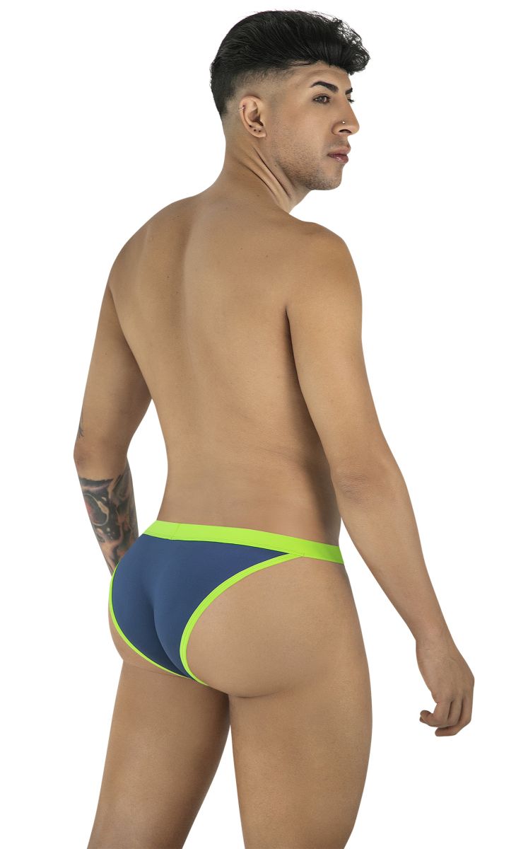 Model wearing a navy bikini brief with neon green trim, viewed from the back.
