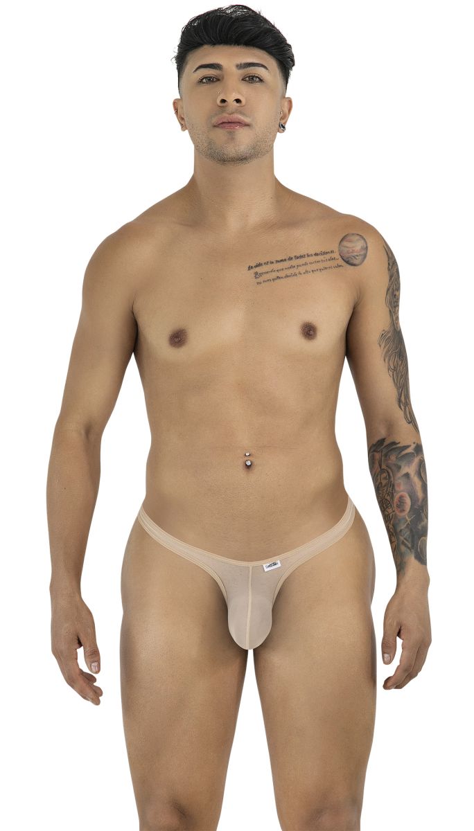 A man wearing beige mesh thongs, posing front-facing against a white background.