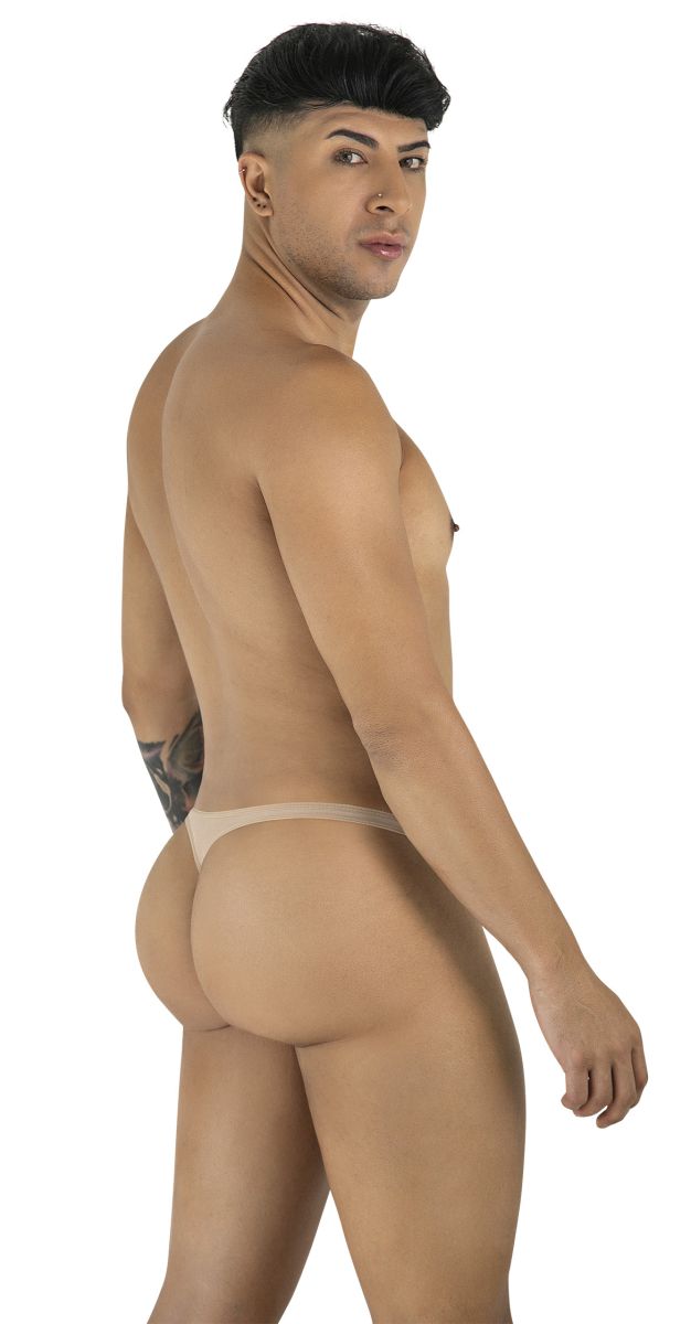 Man seen from behind wearing a beige mesh thong, standing and looking over his shoulder.
