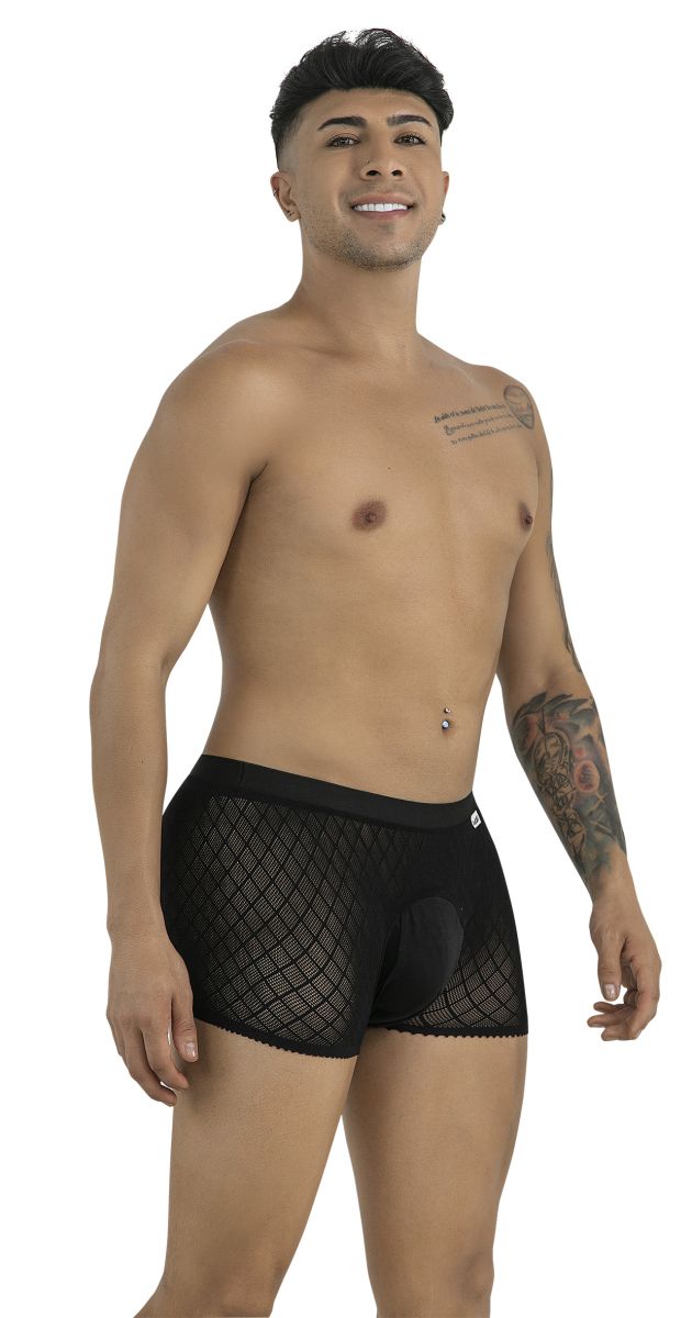 A model poses in black CandyMan boxer briefs featuring a diamond-patterned mesh texture and solid front pouch.