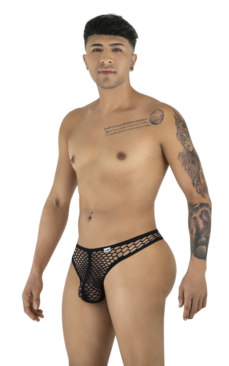 A man models a black fishnet thong, posing against a white background.