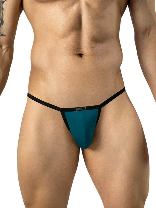 Front view of a model wearing petrol blue sleek thongs with black trim and a branded waistband.