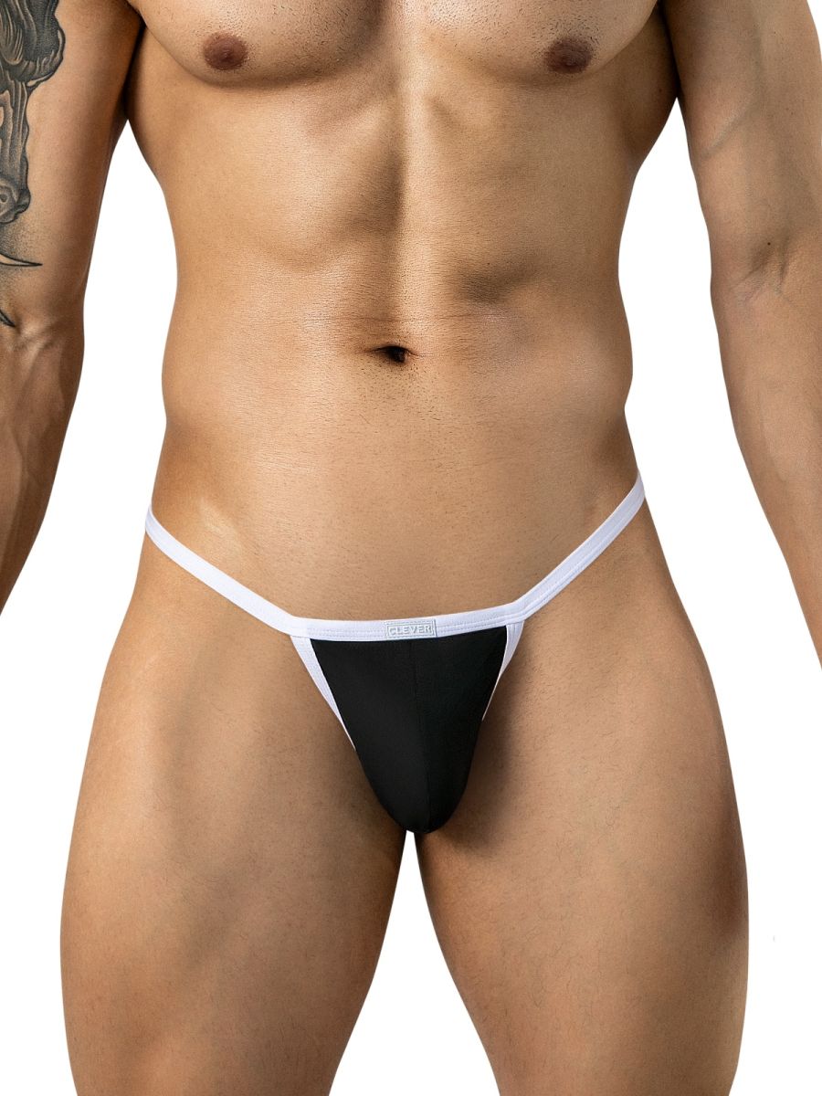 Front view of a model wearing black thong underwear with contrasting white trim and waistband.
