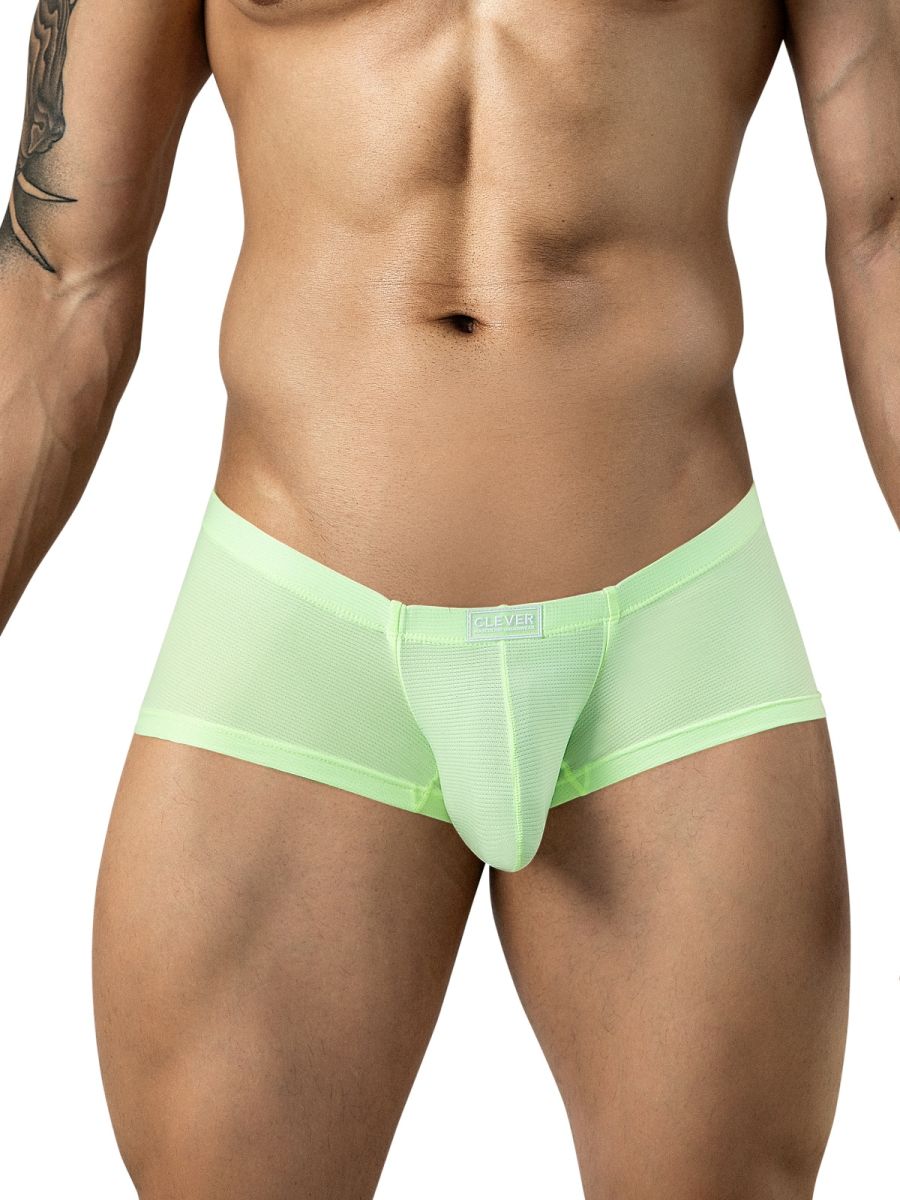 A person wearing neon green mesh trunks with a small Clever logo label on the waistband.