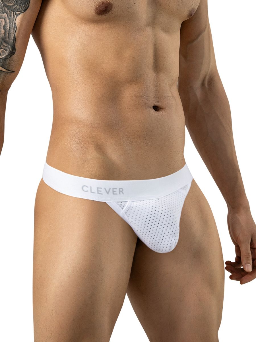 Front view of a model wearing a white mesh thong with a branded waistband.