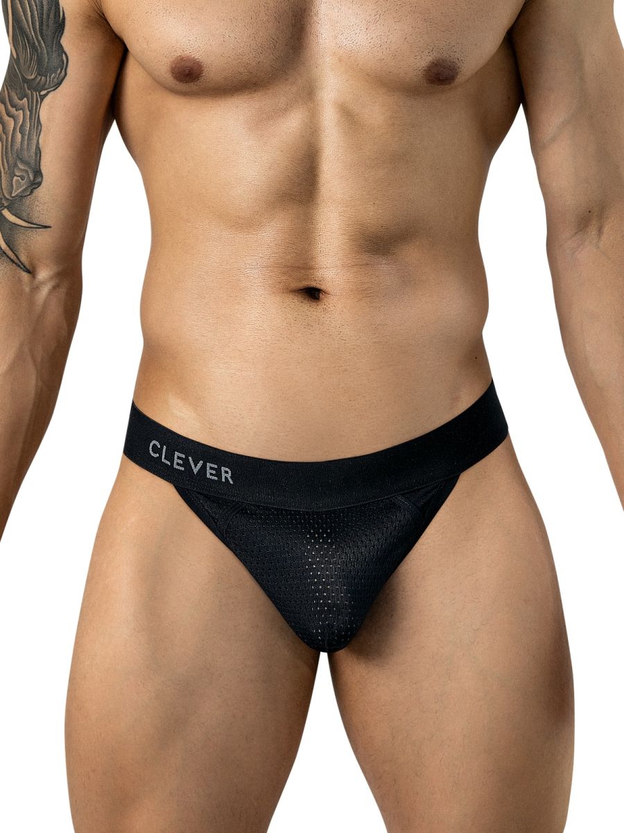 Front view of a model wearing black Clever thong underwear with a branded waistband.