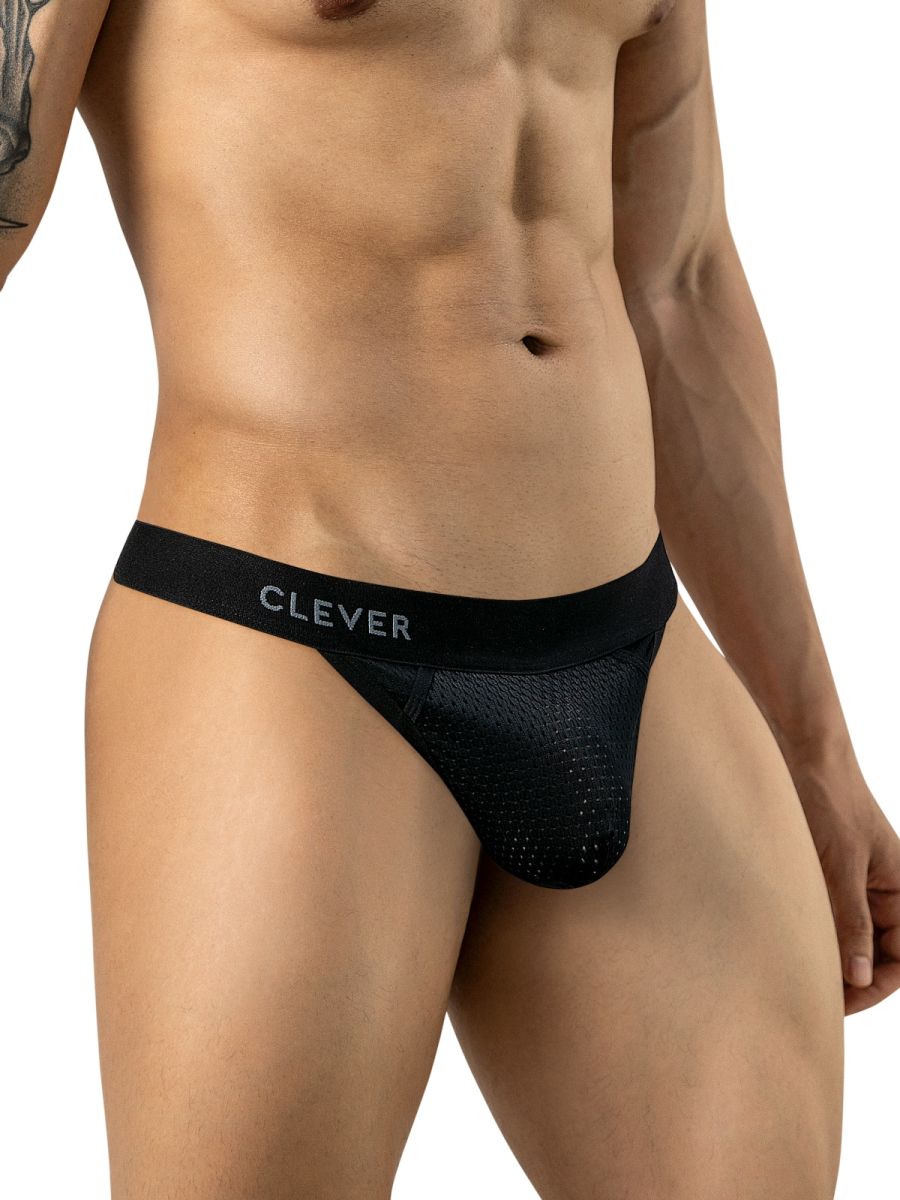 A model wears black mesh thong underwear featuring a branded waistband in a three-quarter view.