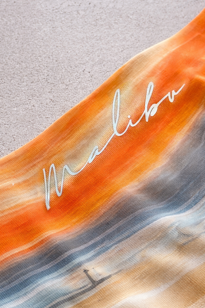 Come-over silky seamless boxer briefs in vibrant orange and blue gradient with silver malibu logo design