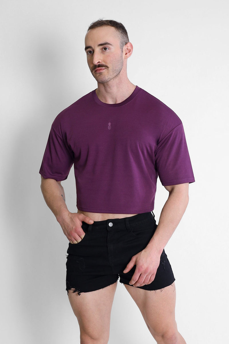 Purple cool-dry oversized relaxed crop top with subtle chest logo made from breathable fabric for casual wear