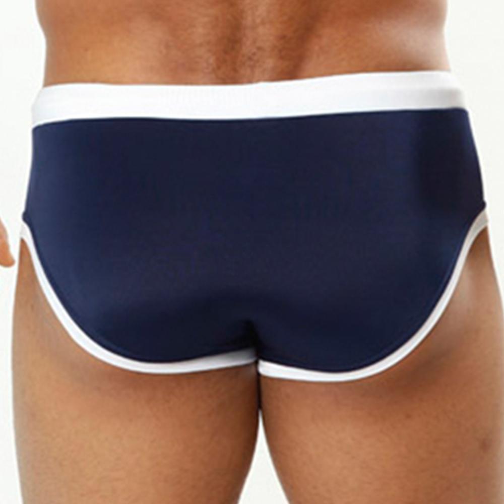 Navy blue cover male cm0706 swimwear trunks with white trim designed for comfortable beach and pool use