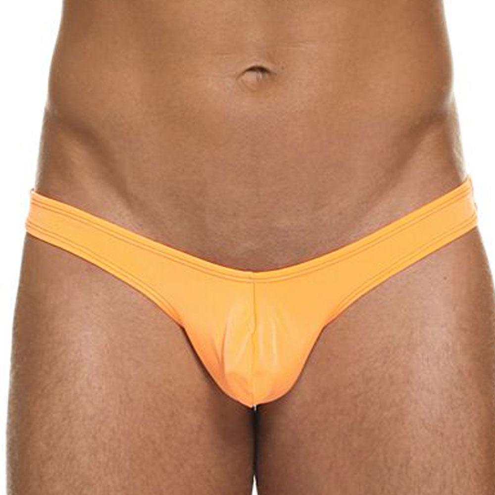 Bright orange shiny fabric Cover Male CM202 thong with narrow waistband and central seam in front view