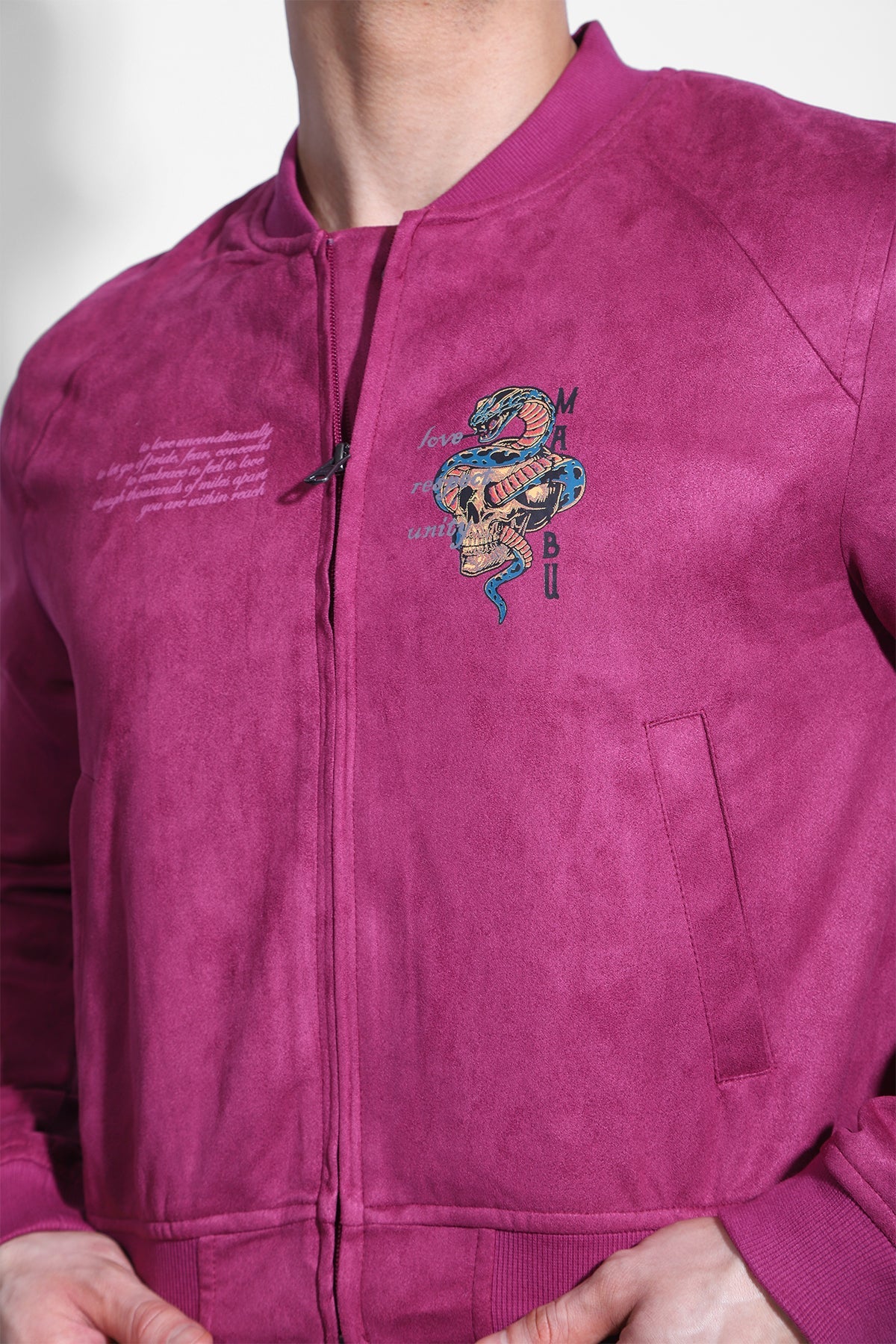 Cropped magenta suede bomber jacket with embroidered snake and skull featuring mabu text on the left chest