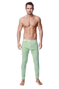 Light green crosstrain thermal yoga pant with form-fitting compression, textured pattern, and colorful geometric waistband
