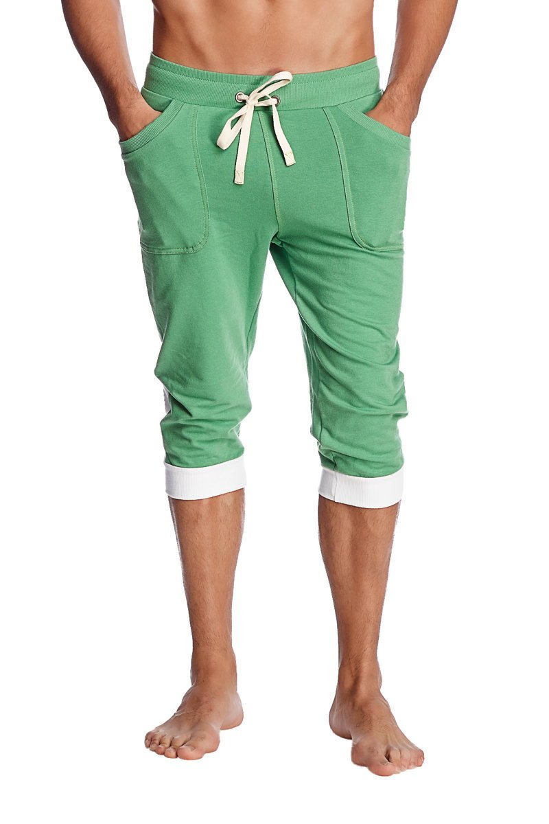 Cuffed yoga pants in bamboo green with white drawstring and contrasting white cuffs made from soft fabric