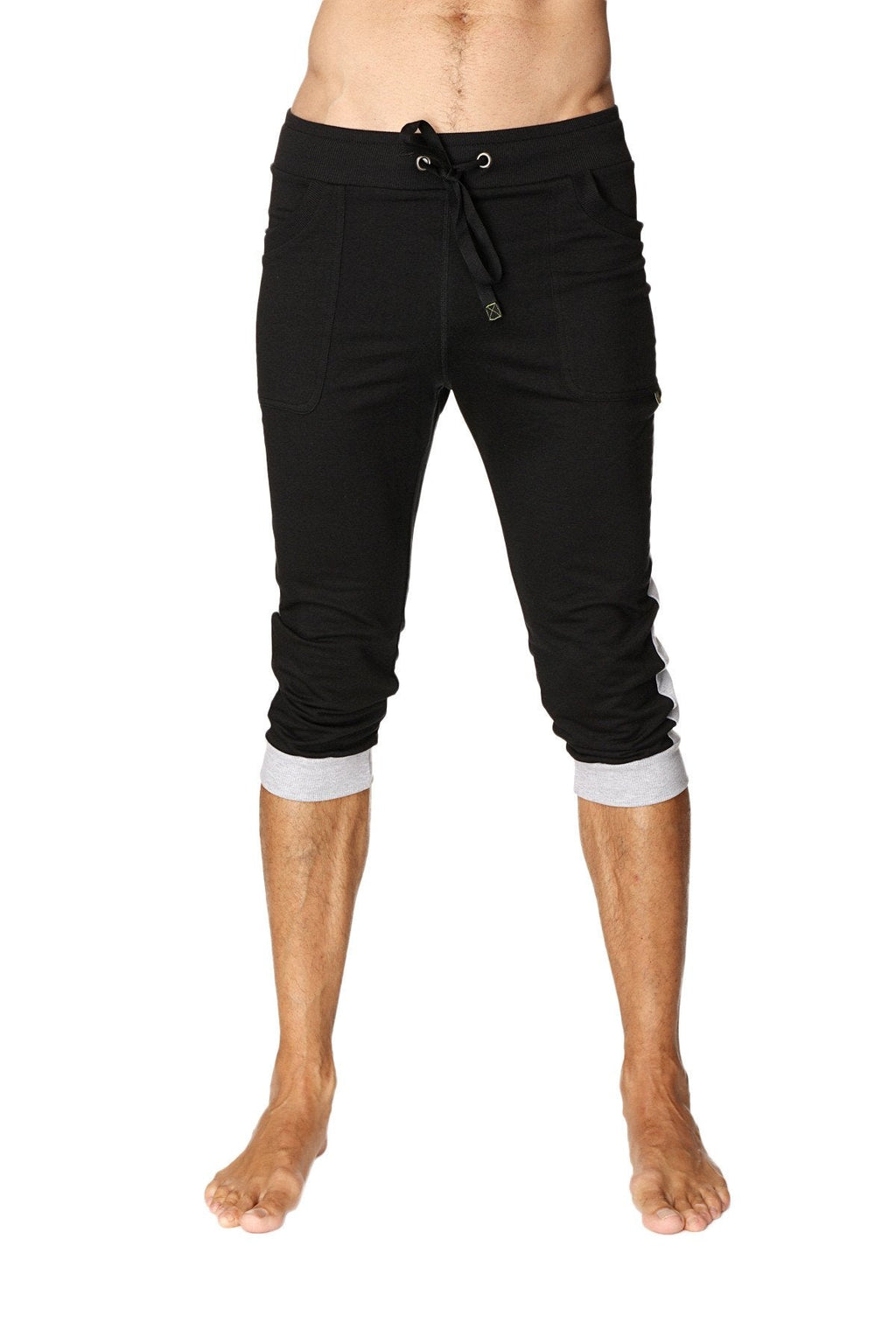 Black cuffed yoga pants with grey contrasting cuffs and side stripes in capri-length jogger style