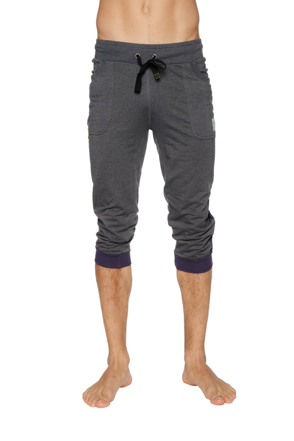 Cuffed yoga pants in charcoal heathered fabric with navy ribbed cuffs and black drawstring waistband