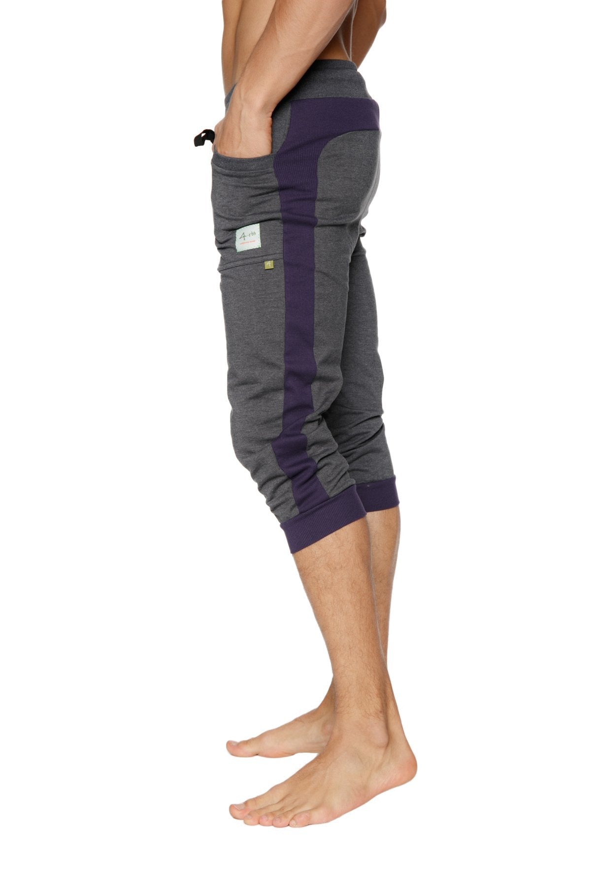 Cuffed yoga pants in charcoal and eggplant with drawstring waistband side pockets and ribbed cuffs for athletic wear