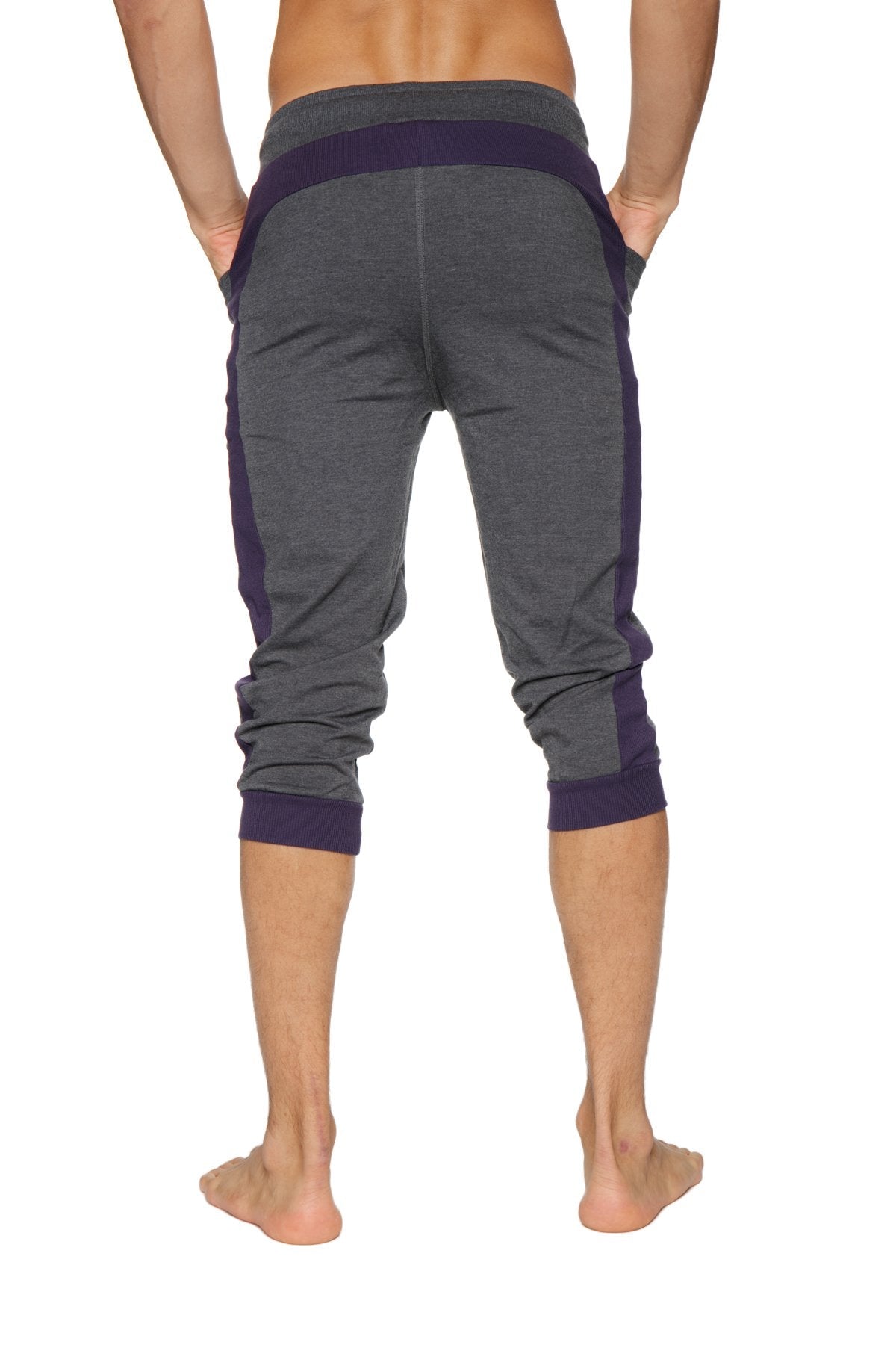Dark gray and navy blue cuffed yoga pants with ribbed waistband and cuffs in capri-length style
