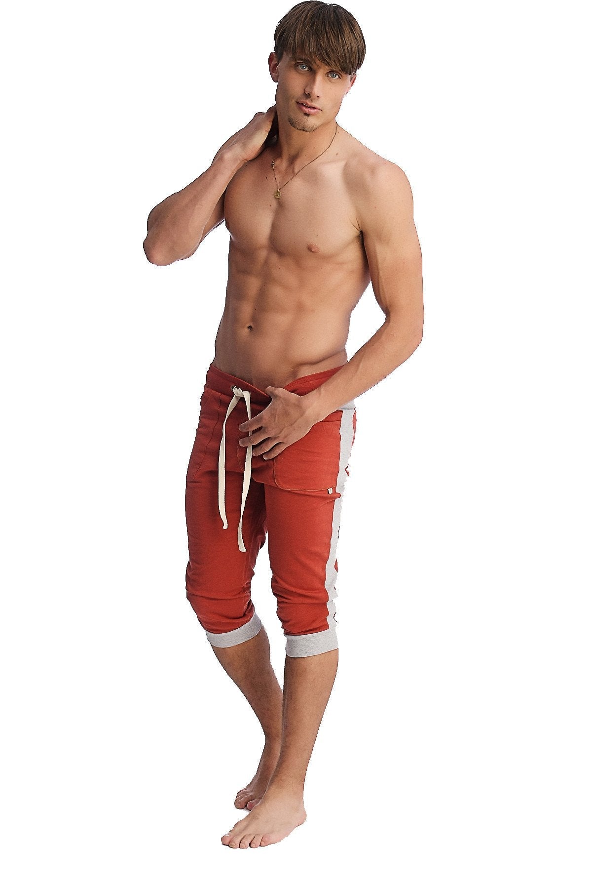 Red athletic shorts with white side stripes and matching drawstring designed for active wear and comfort