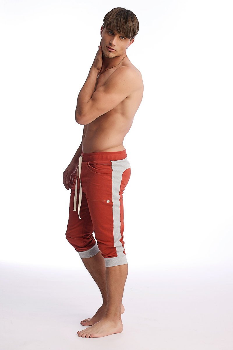 Red and white cuffed yoga pants with drawstring waistband designed for athletic wear and comfort
