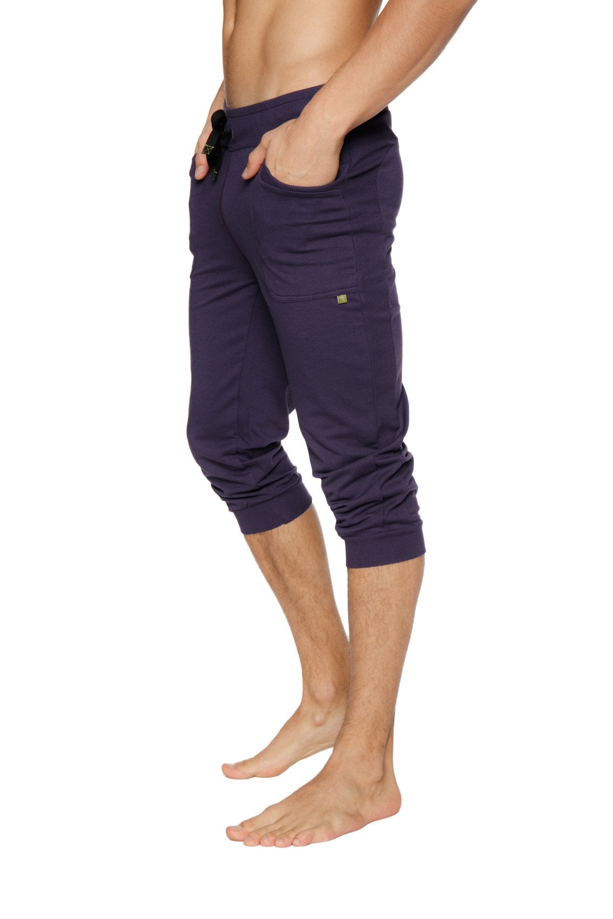 Navy blue capri-length jogger pants with elastic waistband and side pockets for comfortable casual wear