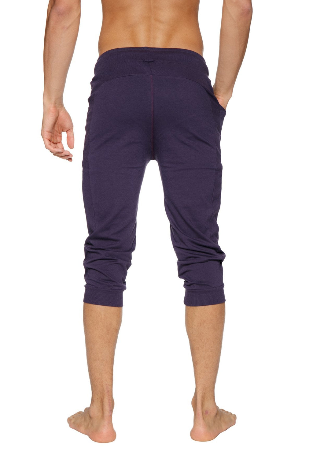 Dark purple cuffed yoga pants made of stretchy fabric with elastic waistband for comfortable wear
