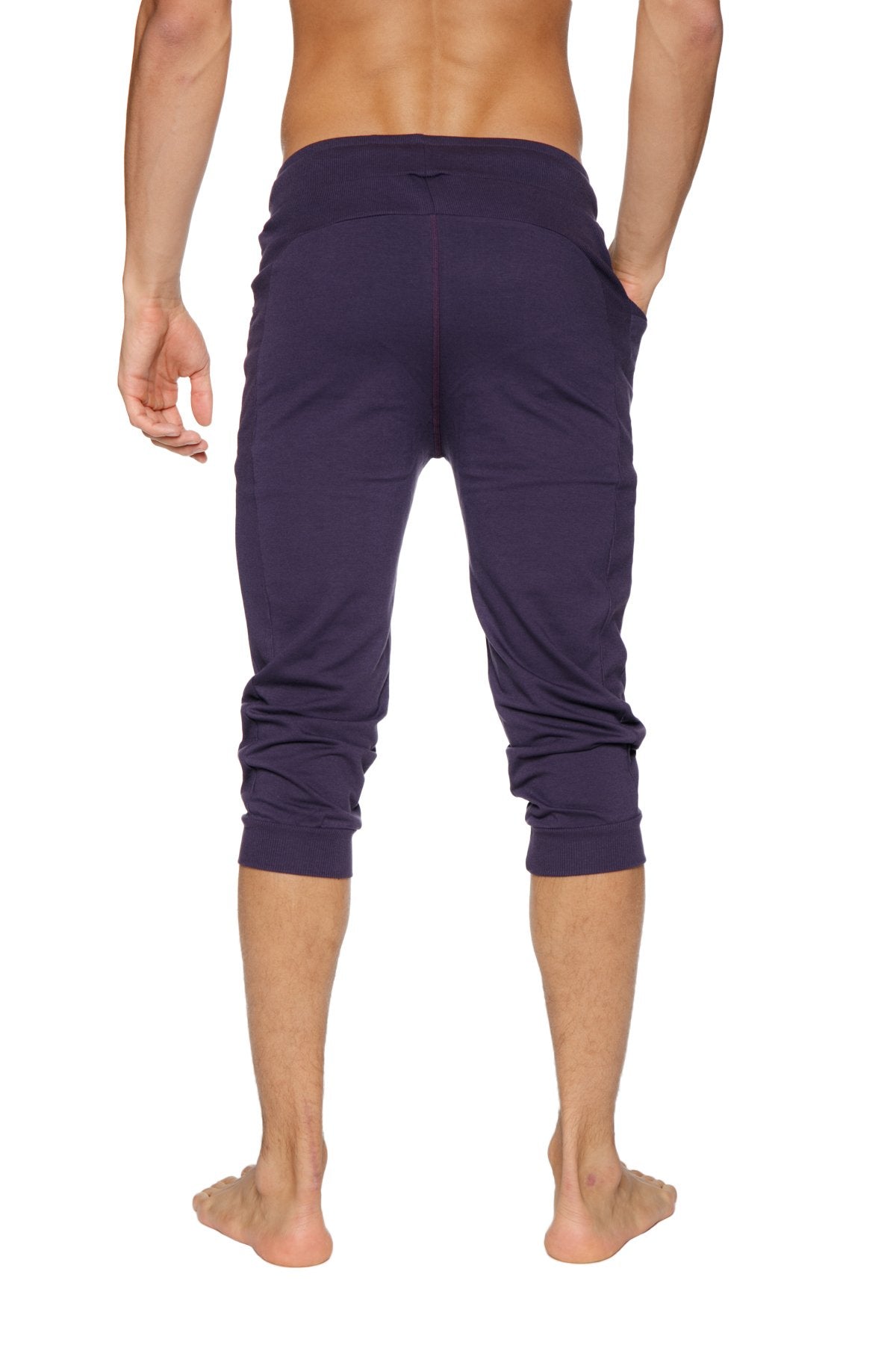 Dark purple cuffed yoga pants made of stretchy fabric with elastic waistband for comfortable wear