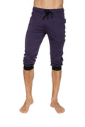 Dark purple eggplant capri-length cuffed yoga pants with black drawstring waistband and elastic cuffs