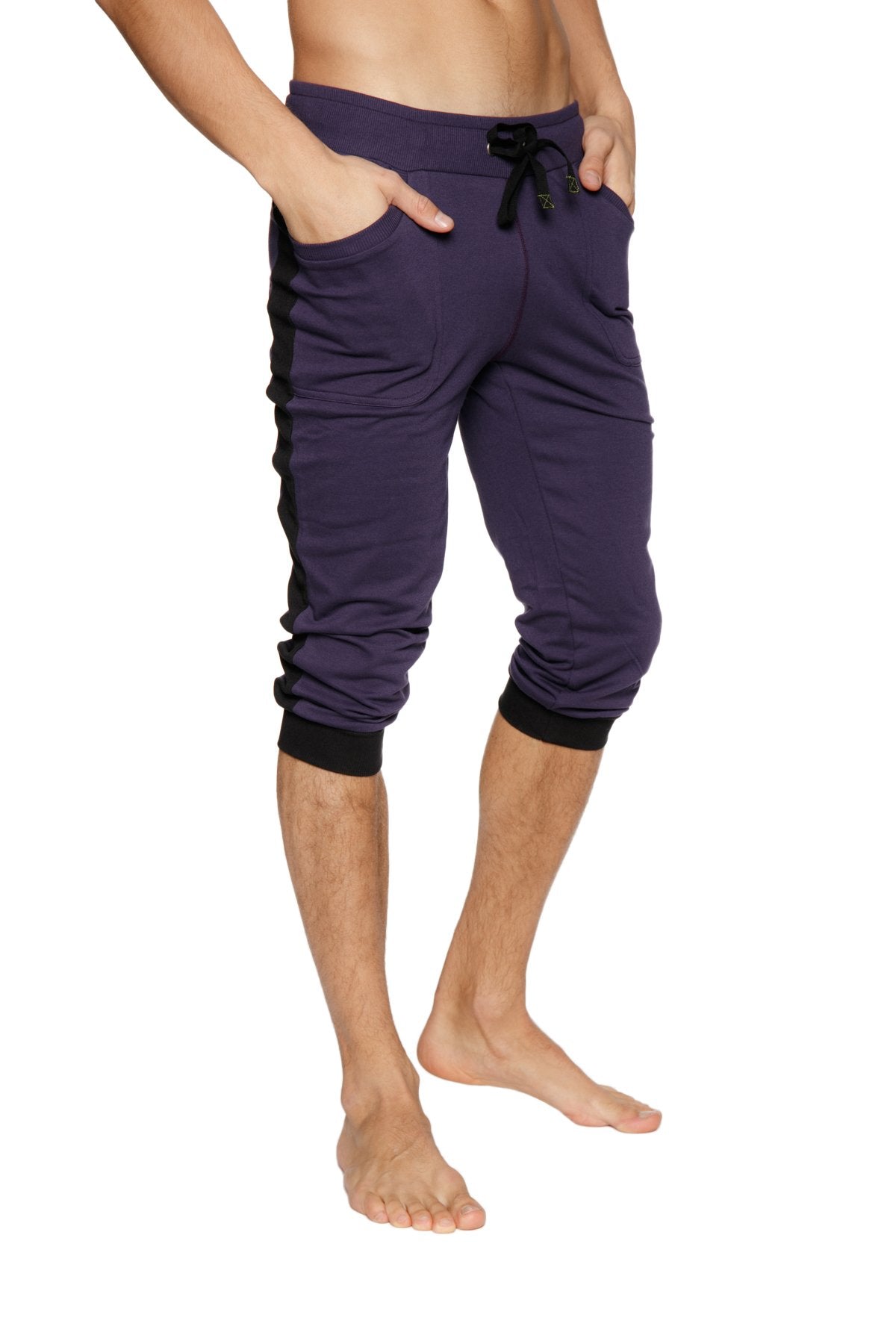 Cuffed yoga pants in eggplant with black side panels featuring elastic cuffs and a drawstring waistband