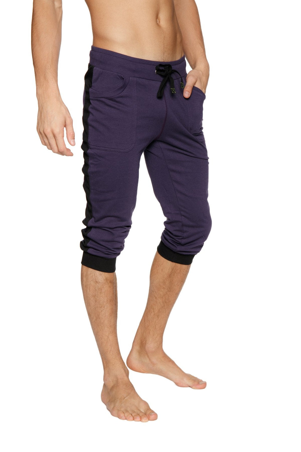 Cuffed yoga pants in eggplant with black side panels elastic cuffs and capri-length jogger style