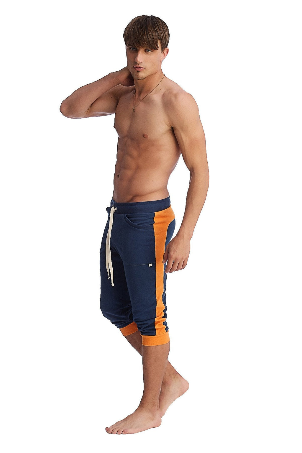 Navy blue and orange cuffed yoga pants with white drawstring designed for athletic and casual wear