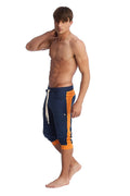 Navy blue and orange cuffed yoga pants with white drawstring designed for athletic and casual wear