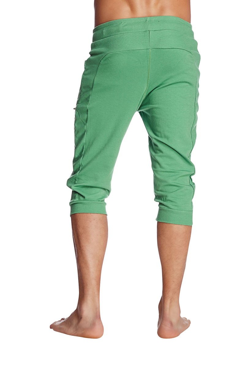 Cuffed yoga pants in solid bamboo green with elastic waistband and side pockets for comfortable wear
