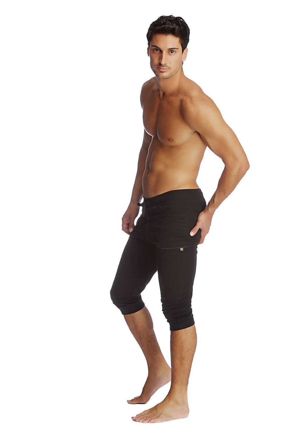 Black cuffed yoga pants with snug fit and subtle side pocket detailing perfect for athletic use