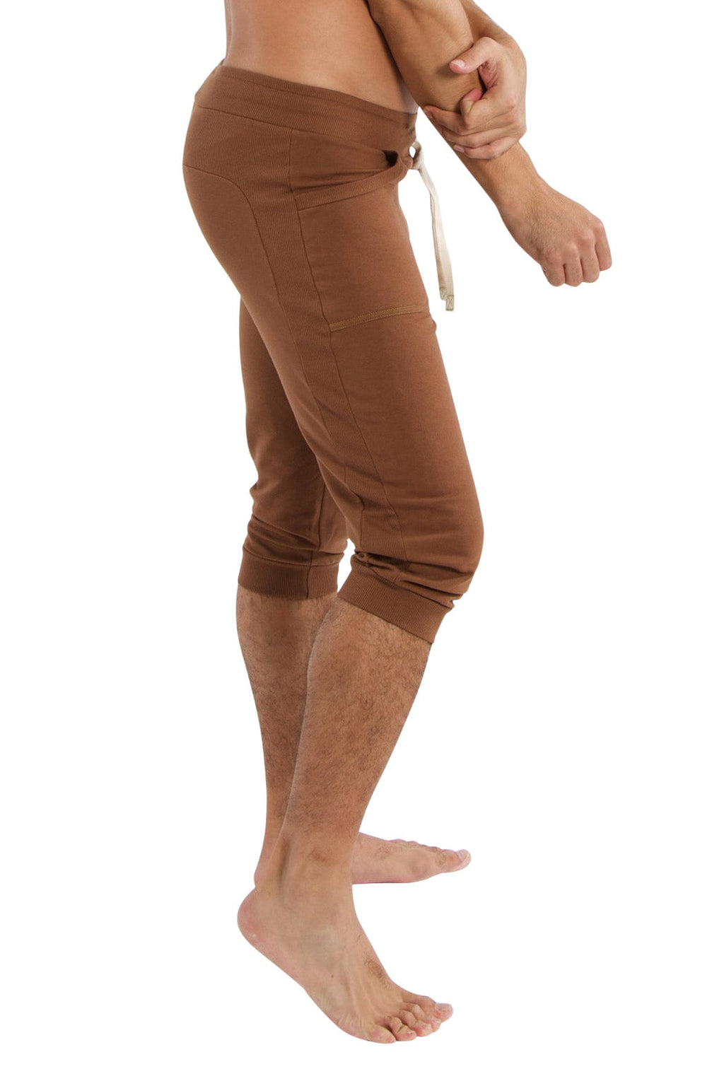 Brown cuffed yoga pants with drawstring waistband and side pockets in solid chocolate color for comfortable wear