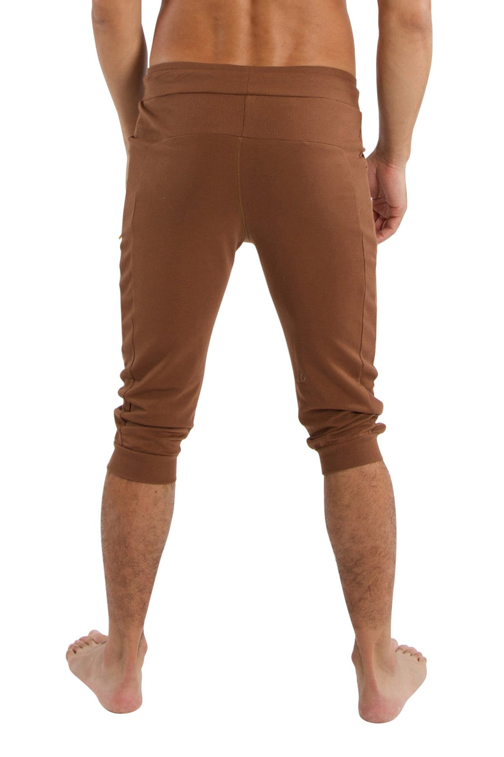 Brown stretchy cuffed yoga capri pants with elastic waistband and rolled cuffs in solid chocolate color
