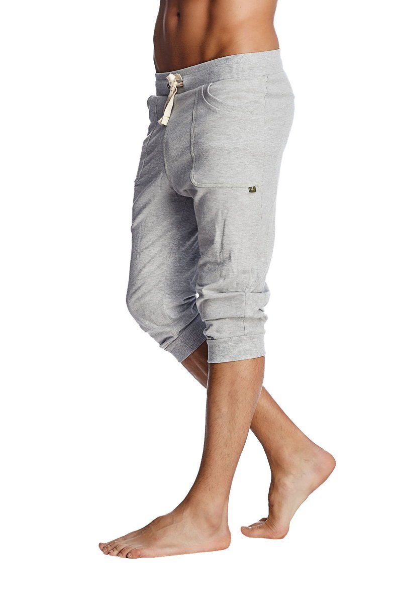 Gray heathered cotton cuffed yoga pants with a drawstring waistband and rolled cuffs for comfortable wear
