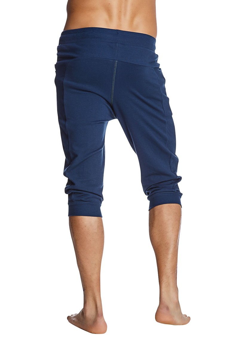 Navy blue stretchy cuffed yoga pants with elastic waistband and rolled cuffs for comfortable activewear
