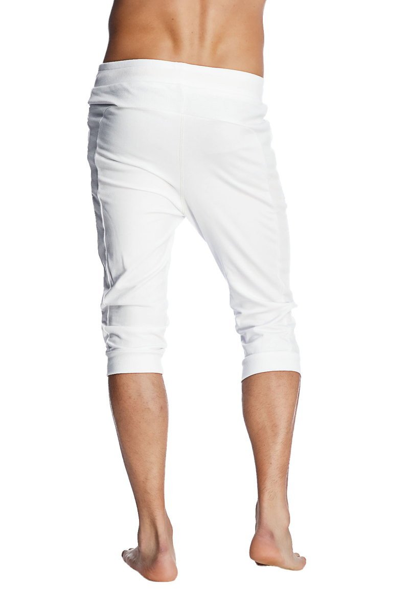 White cuffed yoga pants with a relaxed fit and elastic waistband perfect for comfortable casual wear