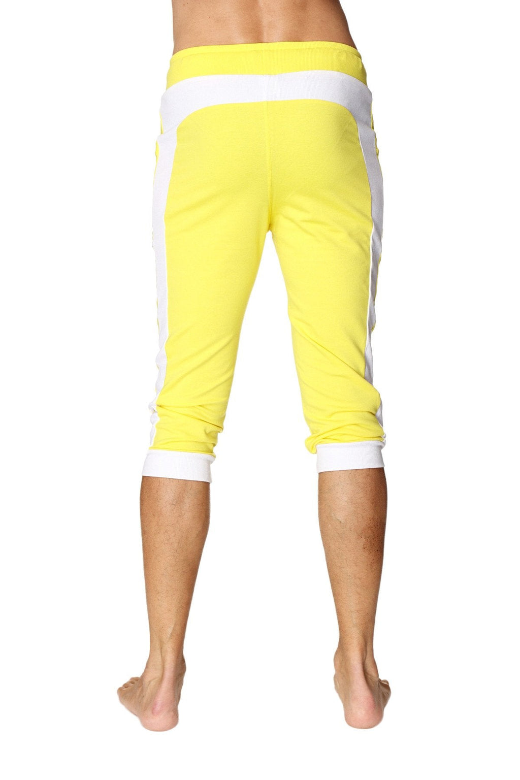 Bright yellow cuffed yoga pants with white side stripes and elastic waistband for comfortable activewear