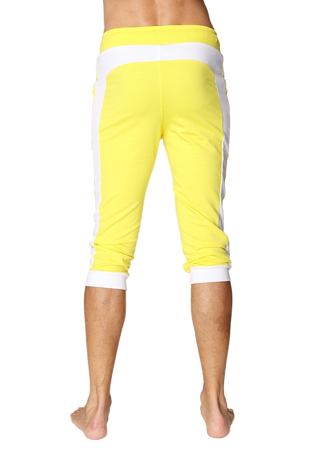 Bright yellow cuffed yoga pants with white side stripes and elastic waistband for comfortable activewear