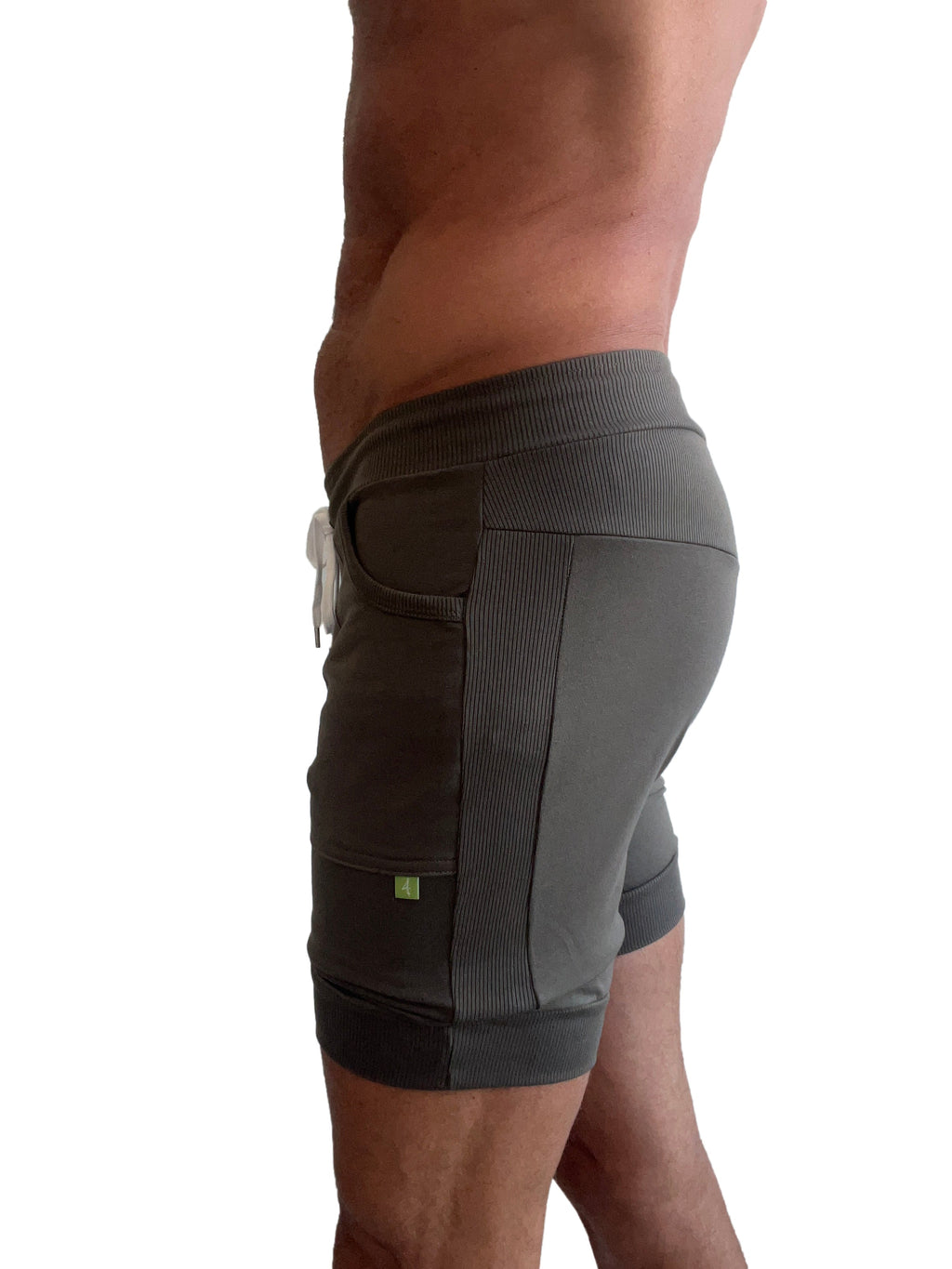 Dark gray cuffed athletic shorts with ribbed side panels and white drawstring designed for yoga and workouts
