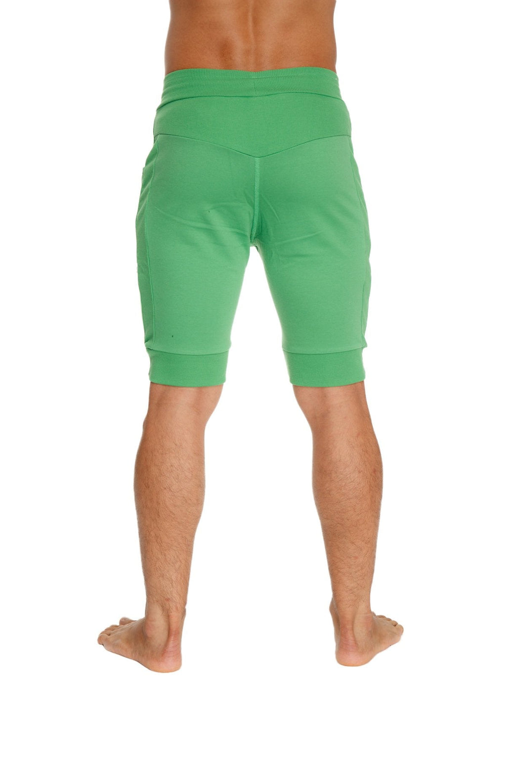 Cuffed yoga shorts in bamboo green with elastic waistband and ribbed cuffs for comfortable athletic wear