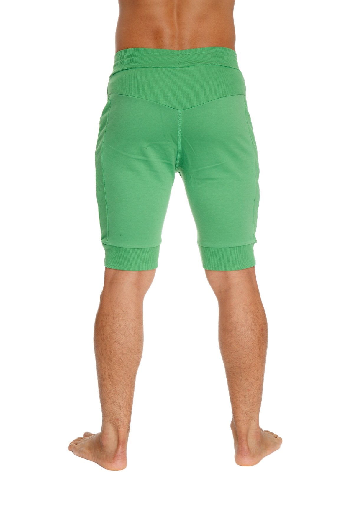 Cuffed yoga shorts in bamboo green with elastic waistband and ribbed cuffs for comfortable athletic wear