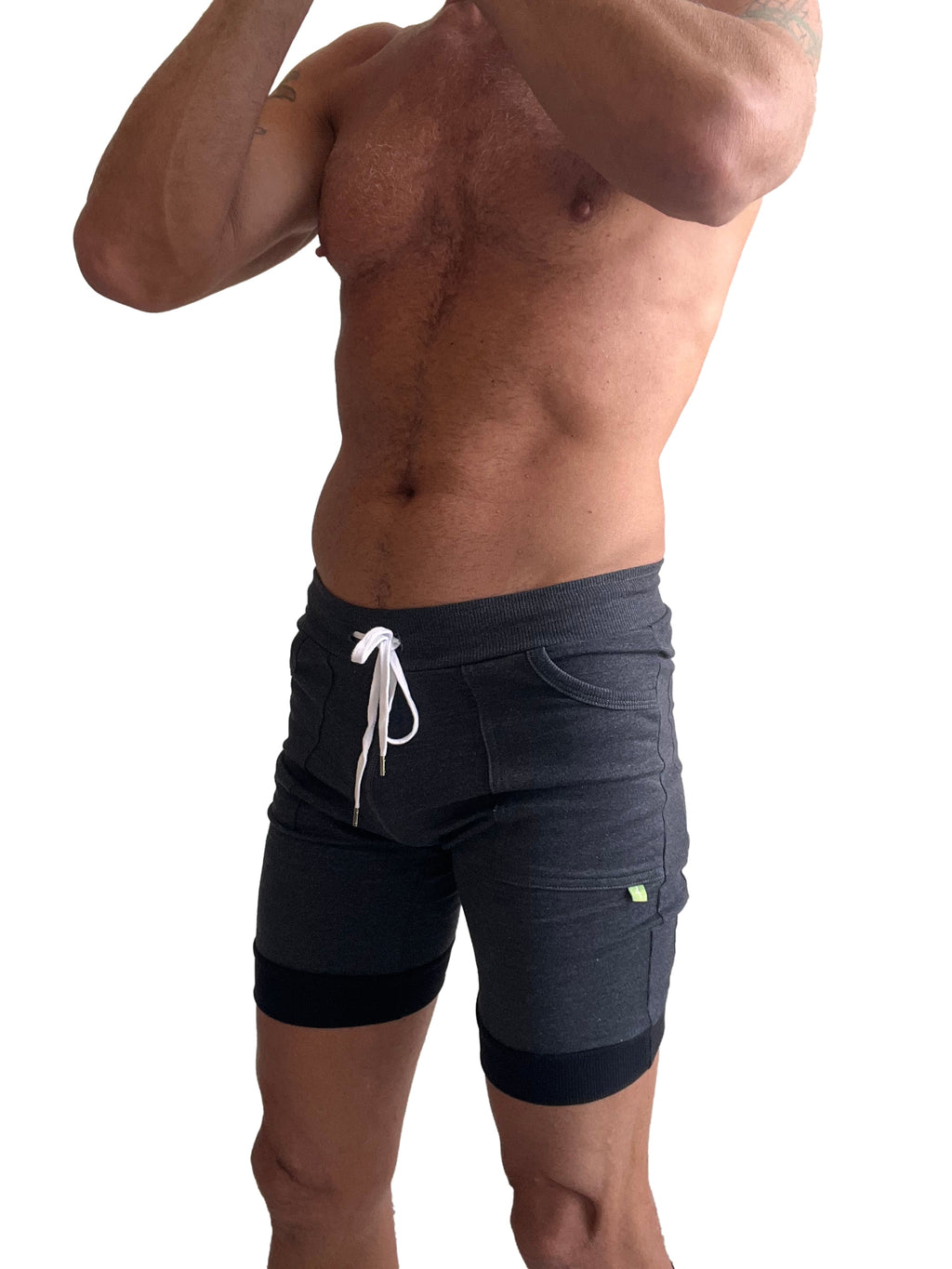Dark gray cuffed yoga shorts with white drawstring and black trim at cuffs designed for athletic wear
