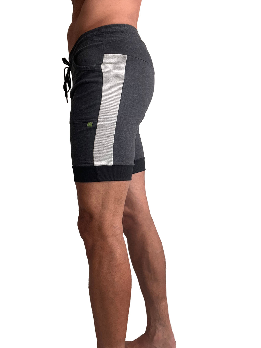 Dark gray cuffed yoga shorts with textured silver stripe and black drawstring waistband for athletic use