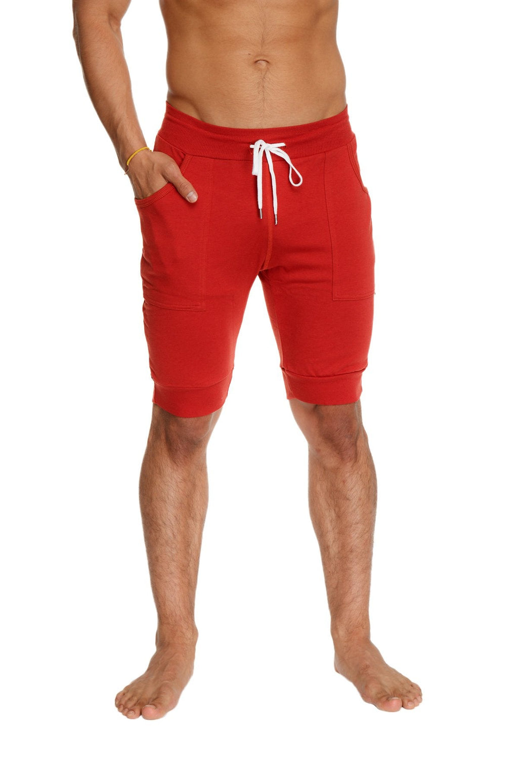 Red cuffed yoga shorts with white drawstring and side pockets designed for comfort and active wear