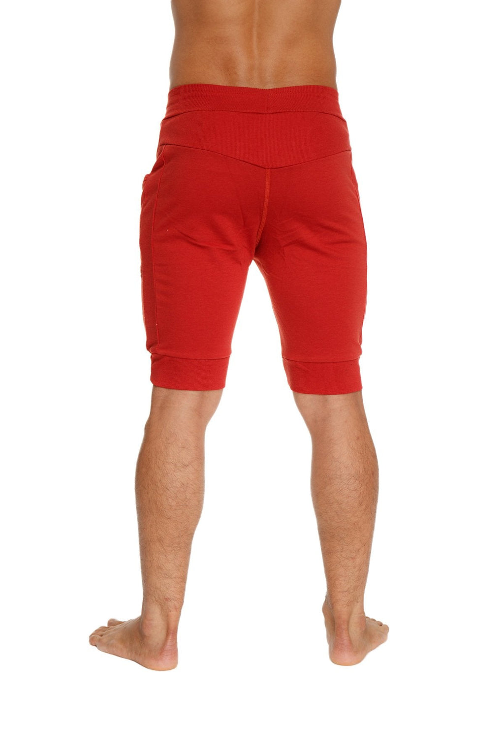 Red cuffed yoga shorts with high-waisted elastic band and ribbed cuffs in cinnabar red for athletic use